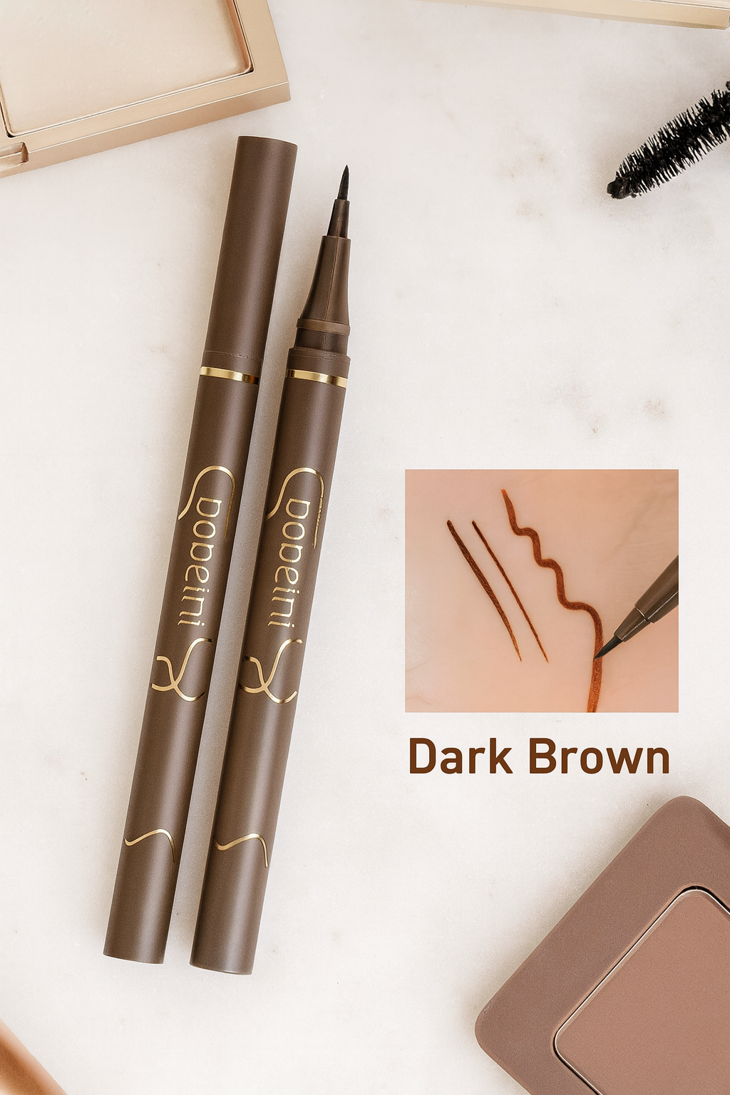 Two dark brown eyeliner pens with a close-up of a line drawn on skin, labeled 'Dark Brown'.